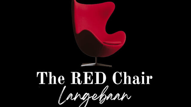 Black background with red chair and white letter stating The Red chair Langebaan