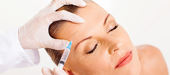 doctor giving face lifting injection