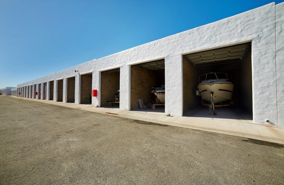 Boat parked inside garages for storage at The Boatyard in Langebaan.