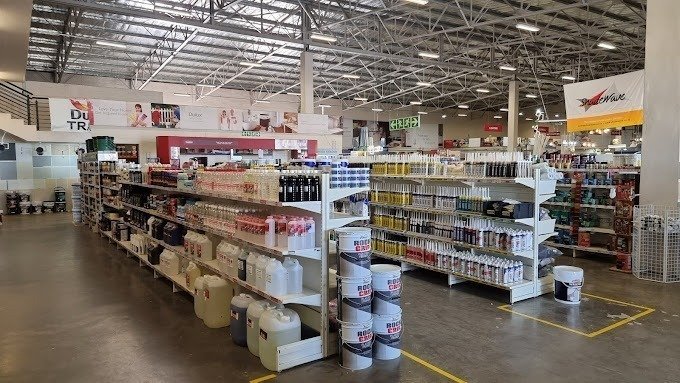 Lots of shelves with merchandise on display inside Brights Hardware Store in Langebaan. Wide isles and open ceilings gives a industrial feeling to this store.
