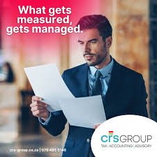 A Accountant at CRS Group in Langebaan study some financial documentation as a accounting Service in Langebaan.