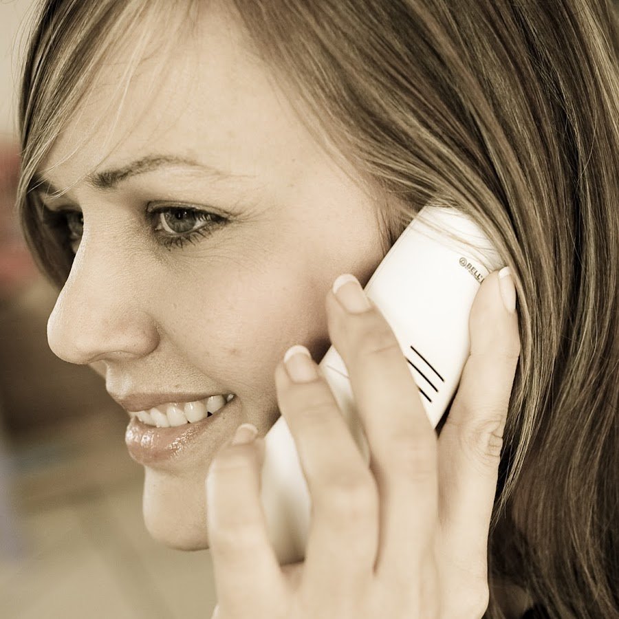 A close up picture of Drienie Brand from D Brand Attorneys in Langebaan, talking on a cellphone.