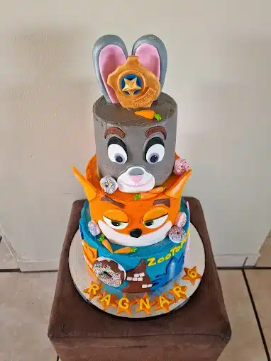 A fun birthday cake for kids with 4 layers of animals by D-Litefull Things in Langebaan. Home cake catering service.