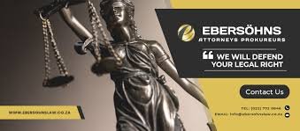 A Statue of legal justice and logo of Ebersohns Attorneys in Langebaan in white letters on black background.