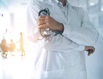 Doctors & Specialists in Langebaan provides medical care in Langebaan as this doctor standing in a hospital passage