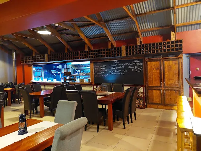 Wooden interior and layout of Queens Cottage Restaurant as one of the favorite Langebaan Restaurants, with cozy atmosphere