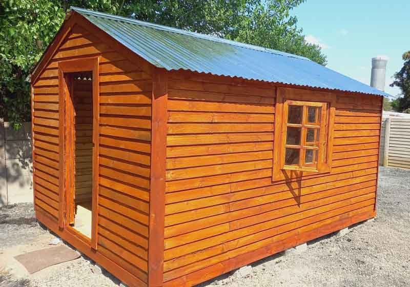 A Small Wendy House in the back yard with door and window and sloping roofsheets by Laguna Wendys in Langebaan.