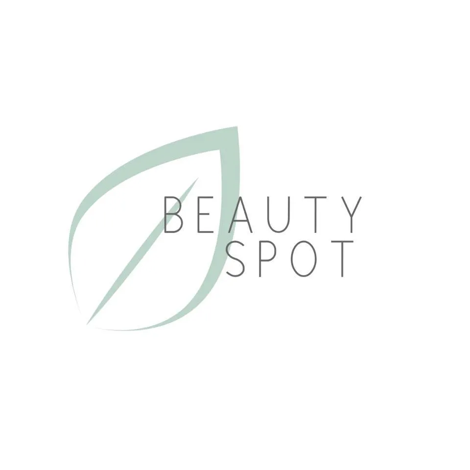 The logo of the beauty Spot in Langebaan with white background, grey letters and graphics in light green colour.