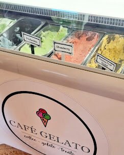 A Icecream fridge that display different flavours of gelato icecream with logo of Cafe Gelato in Langebaan on the side.