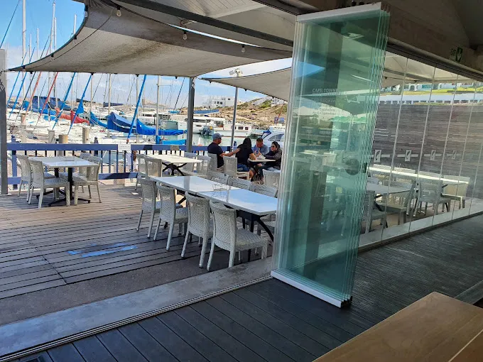 Glass door leading to outside seating area of Cape Town Fish Market at Club Mykonos, one of the many Langebaan Restaurants