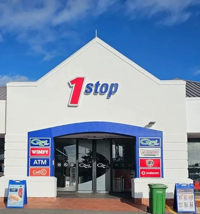 The entrance to the shops at Engen West Coast 1 Stop in Langebaan with signage on the wall and display of all amenities inside.