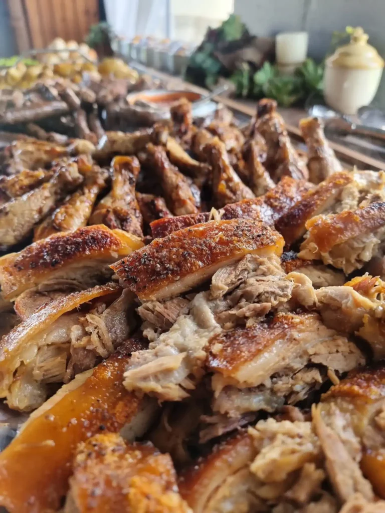Roasted meat with a spitbraai on display on a table by Langebaan Spitbraai, Catering and Decor in Langebaan.