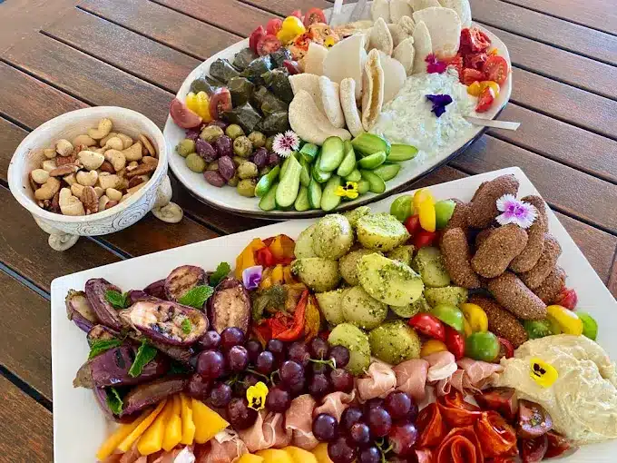 Three plates with variety food and snacks on display for treats at Soldato Cafe in Langebaan. This coffee shop is located on the golf course in Langebaan.