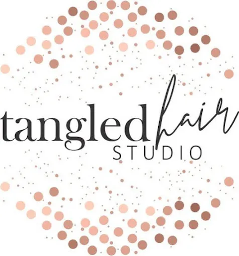 The logo of Tangled hair Salon in Langebaan with letters in grey with differnt shades of brown dots in a circle on a white background.