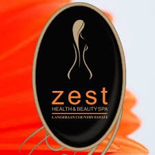 The logo of Zest Health and Beauty Spa in Langebaan with orange background and black oval shaped in the middle to create a eye catching logo